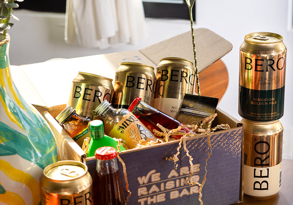 Gold Standard box open with various non-alcoholic cocktail ingredients.