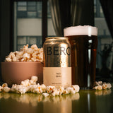 Bero Noon Wheat non-alcoholic beer beside bowl of popcorn.