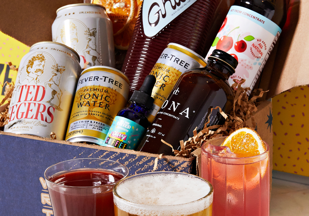 Alcohol-themed gift box with drinks and bottles on a wooden surface