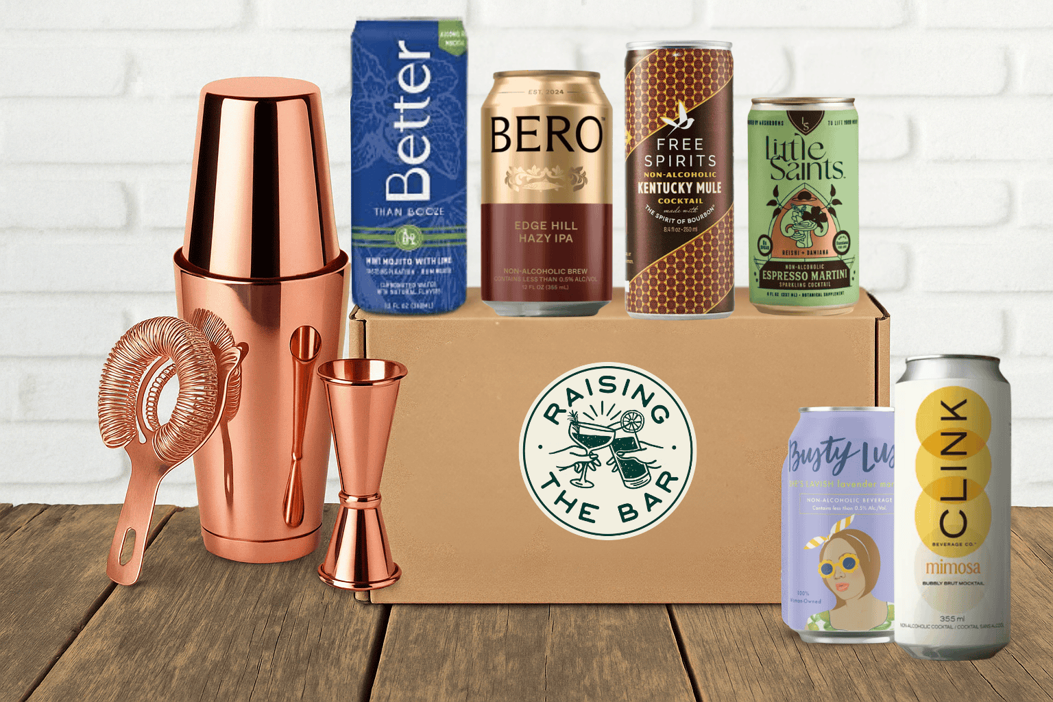 Various non-alcoholic cocktail cans with bar shaker and box