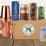 Various non-alcoholic cocktail cans with bar shaker and box