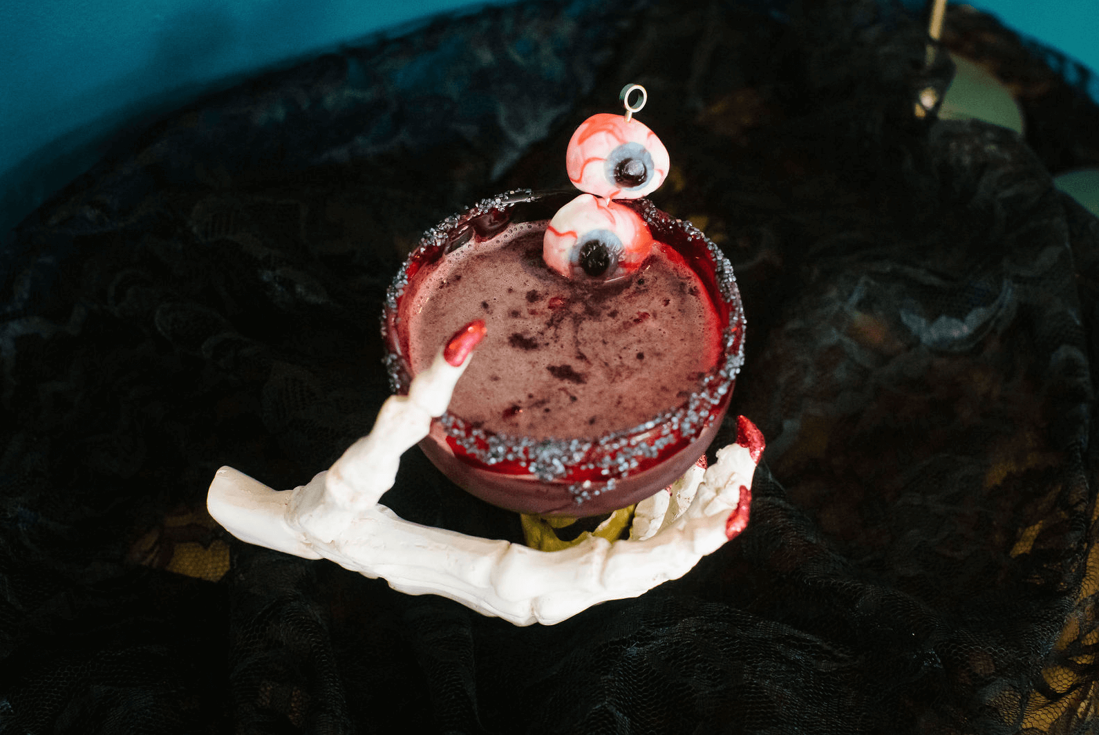 Enjoy a spooky twist on a classic cocktail with our Halloween margarita. Served with gummy worms, this drink is perfect for happy hour or as a fun addition to your cocktail subscription